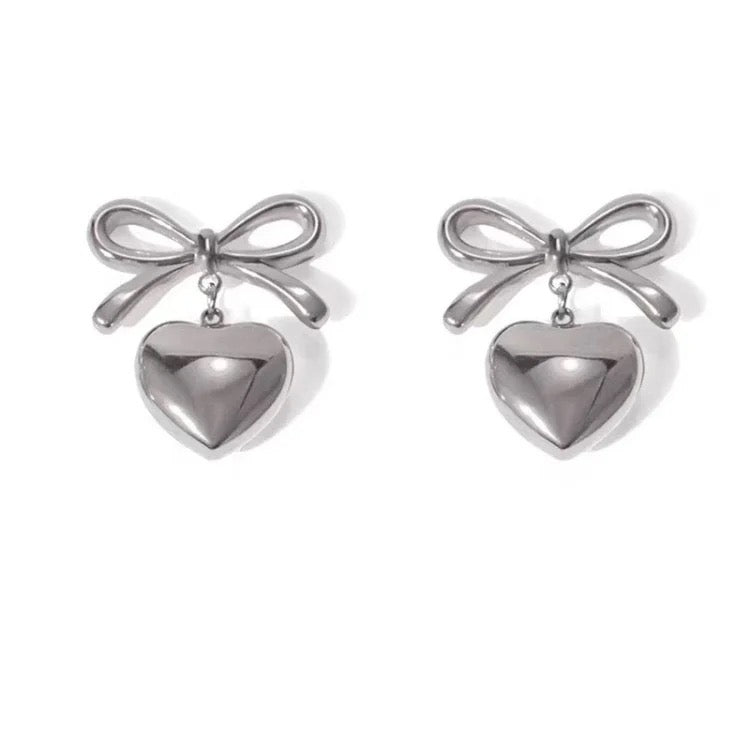 Bow earring with pendant heart